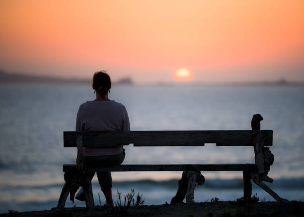 istock girl looking at the sunset 1243572056