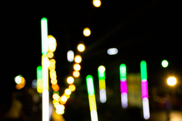 istock Abstract colorful blurr boken background in the darkness 1243597240