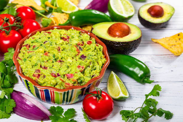 istock Avocado Guacamole Mexican Dip with Avocado, Lime, Tomato and Cilantro 1243602797