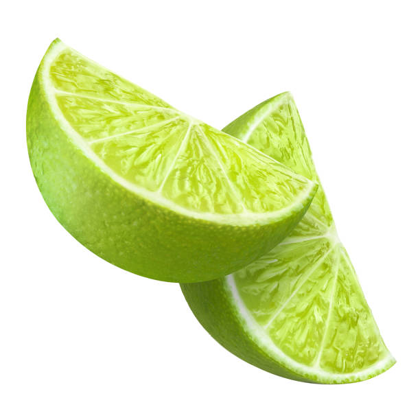 istock Pair of delicious lime slices on white 1243603847