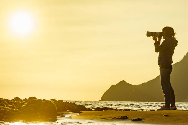 istock Woman with camera on Monsul beach, Spain 1243611563