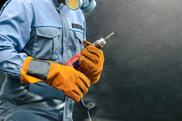 istock Worker wearing safety equipment, man holding drill, ready to  fix something, working  with mechanic tool for repairing and maintenance 1243613216
