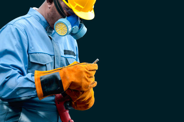 istock Worker wearing safety equipment, man holding drill, ready to  fix something, working  with mechanic tool for repairing and maintenance 1243613230