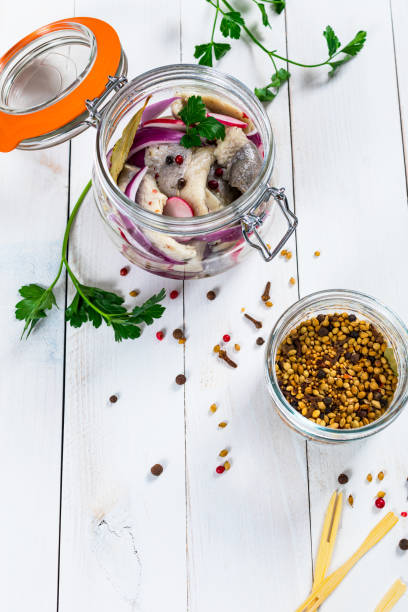 istock Pickled Marinated Herring with Spices, Radish and Red onion 1243615952