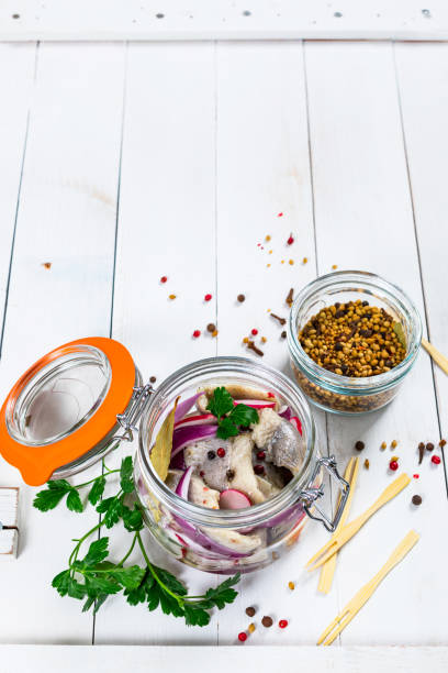 istock Pickled Marinated Herring with Spices, Radish and Red onion 1243617906