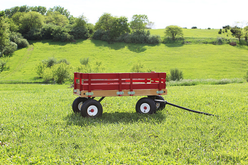 Little Red Wagon sitting on the hillside