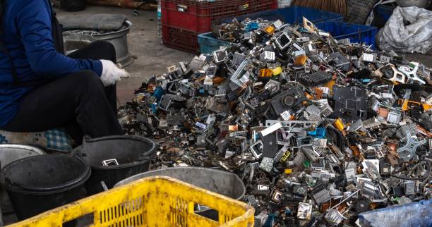 Scrap yard electronic waste for recycling Scrap yard electronic waste for recycling with selective focus. electronic aluminium waste e waste photos stock pictures, royalty-free photos & images
