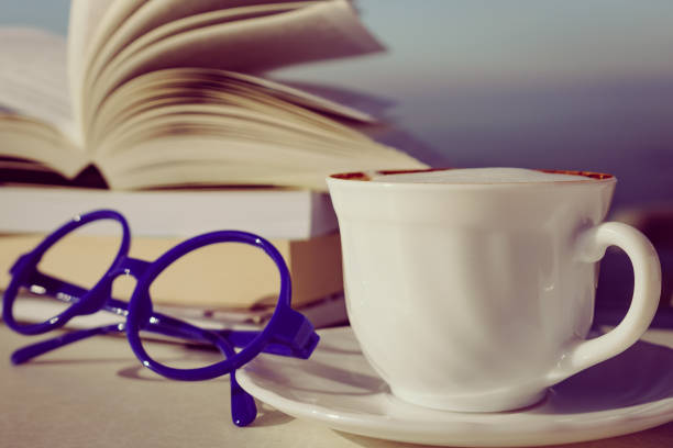 istock Coffee cup and books outdoors 1243627039