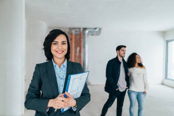 Real estate agent showing new home to clients
