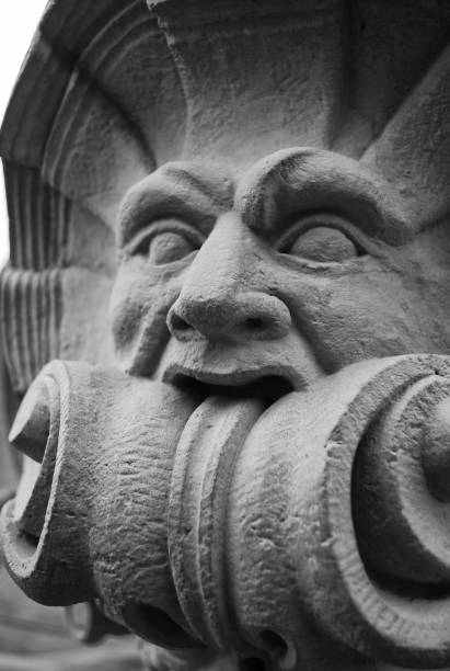 istock a stone sculpture head with some ornaments details 1243652043