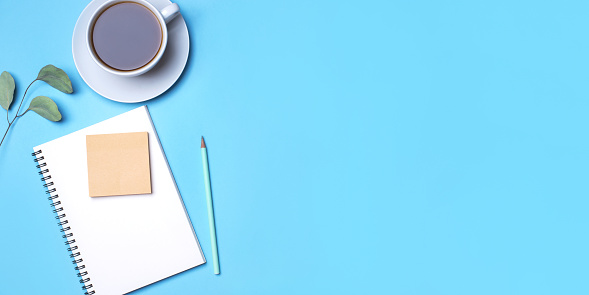 Blue Background With Notepad Pencil And Cup Of Coffee Stock Photo ...