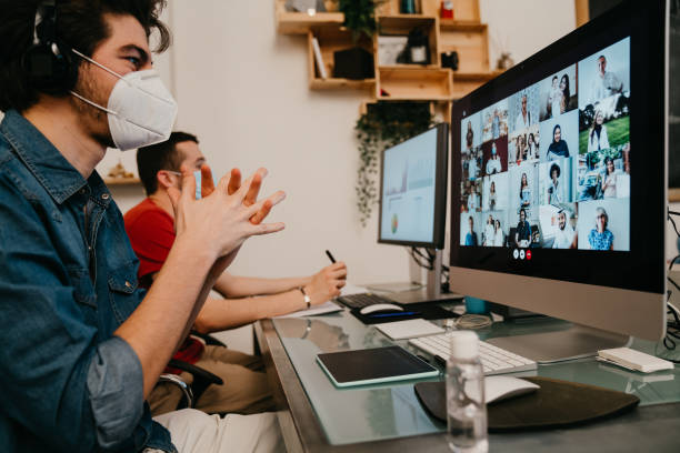 istock Young adult man is washing his hands while is having a work video call in the office 1243660665