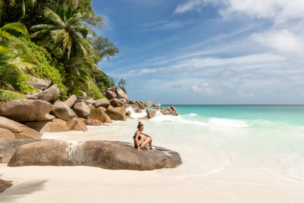 istock woman alone on an exotic beach 1243661798
