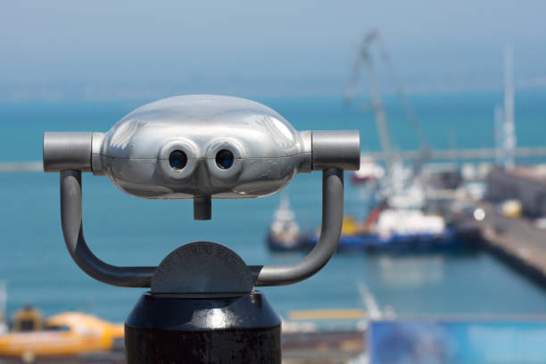 istock Hi spy viewing mashines. Binoculars on the observation place in the seaport. 1243672974