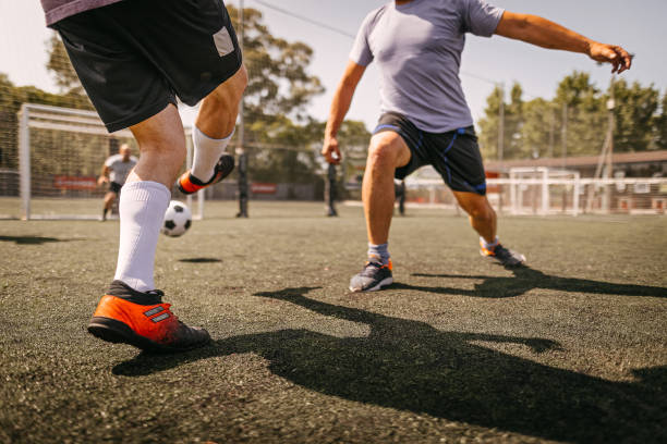 istock Men in action during soccer match on field 1243694545