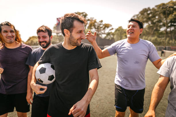 istock Male soccer team celebrating victory 1243695608