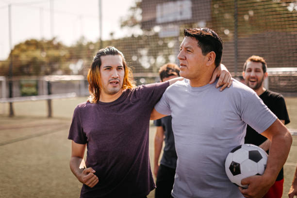 istock Soccer players on sport field 1243698786