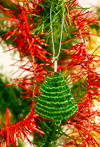 istock green tree ornament made from beads on a Christmas tree 1243708988