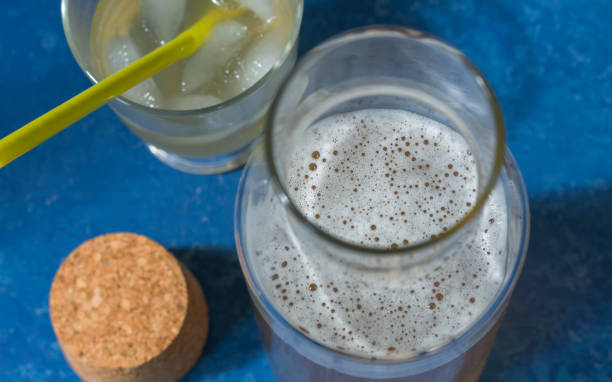 istock cold carbonated tea with lemon and ice, glasses on a blue background, summer drinks, lemonade. 1243725738