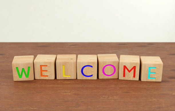 istock Welcome letter blocks in beech wood 1243737126