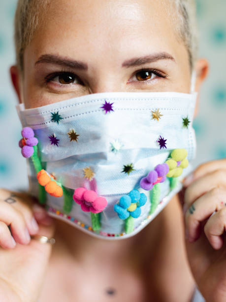istock Young woman with artsy face mask 1243738199