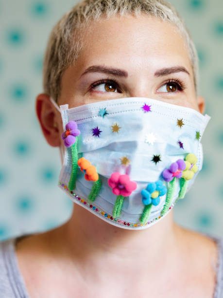 istock Young woman with artsy face mask 1243740888