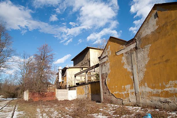 istock Abandoned Industrial Factory Against a Blue Sky 124376416