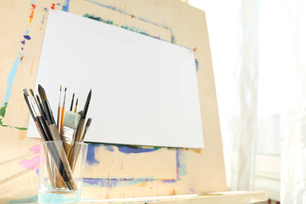 istock art paint brushes on an easel background 1243764329