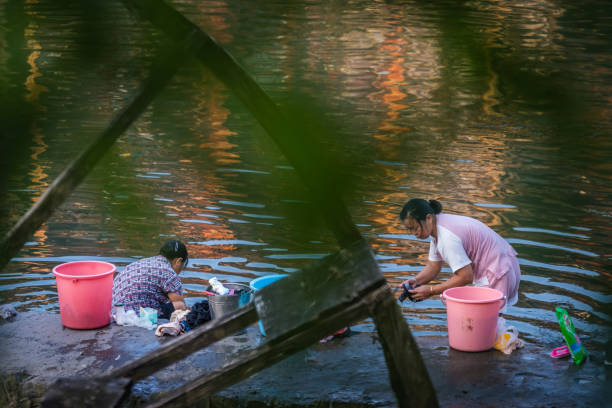 Ranomafana, Madagascar - September 6, 2013: Local people doing the laundry in the river in Ranomafana, Madagascar on September 6, 2013 