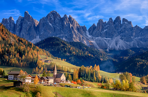 Golden autumn in Val di Funes valley and chapel Santa Maddalena. Odle mountain group. Dolomite's mountains, Italy