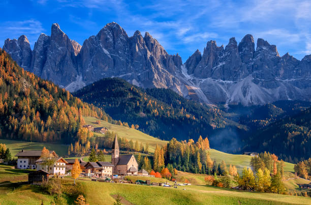 Golden autumn in Val di Funes valley and chapel Santa Maddalena. Odle mountain group. Dolomite's mountains, Italy Golden autumn in Val di Funes valley and chapel Santa Maddalena. Odle mountain group. Dolomite's mountains, italy alto adige italy stock pictures, royalty-free photos & images