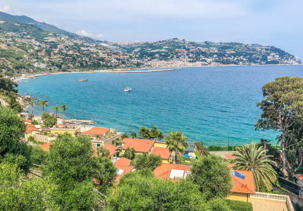 Rolling hills with houses by Sanremo Bay Sanremo Bay is part of the Italian Riviera. Typical extra-urban landscape with houses facing the sea. san remo italy photos stock pictures, royalty-free photos & images