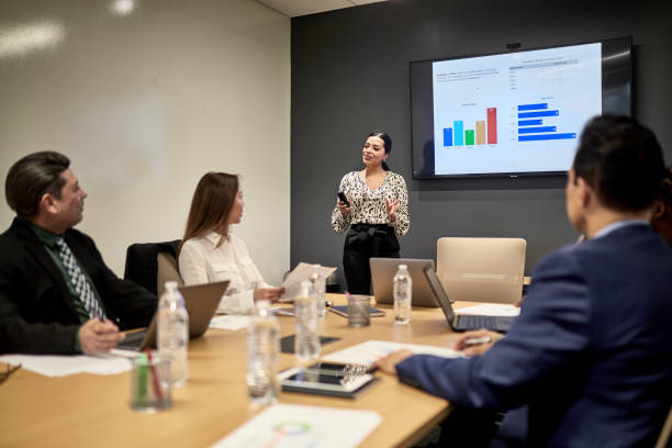 istock Hispanic Female Business Professional Giving Presentation 1243814602