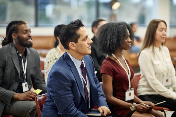 istock Multi-Ethnic Businesspeople Attending Seminar Presentation 1243814638