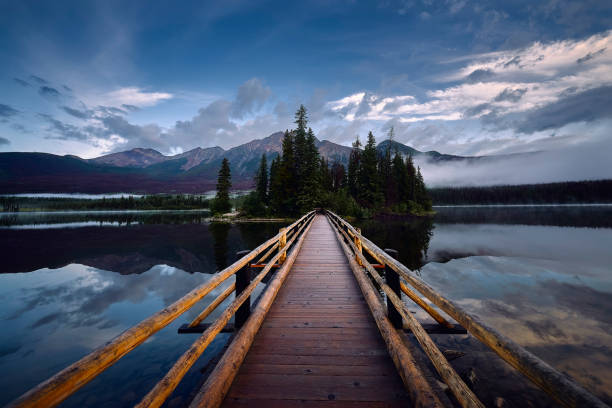 istock Rustic wooden walkway leading to Pyramid Lake Island Canada 1243820447