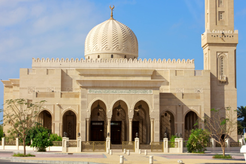 Dubai in the United Arab Emirates - Small mosque close to Jumeirah Beach.  Single Dome. Picture shot against a partly blue sky.