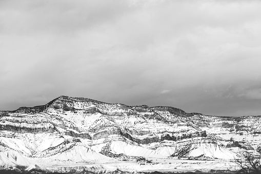 In Western Colorado Black and White Bookcliff Mountain Range Contrasting Nature Scene  on a Gloomy Cloudy Wintry Day (Shot with Canon 5DS 50.6mp photos professionally retouched - Lightroom / Photoshop - original size 5792 x 8688 downsampled as needed for clarity and select focus used for dramatic effect)