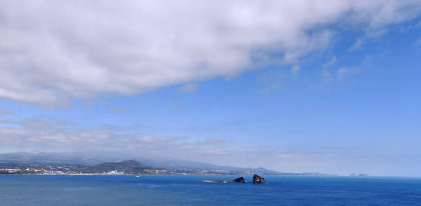 istock A cloudy chance of the bright blue never ending sea 1243852933