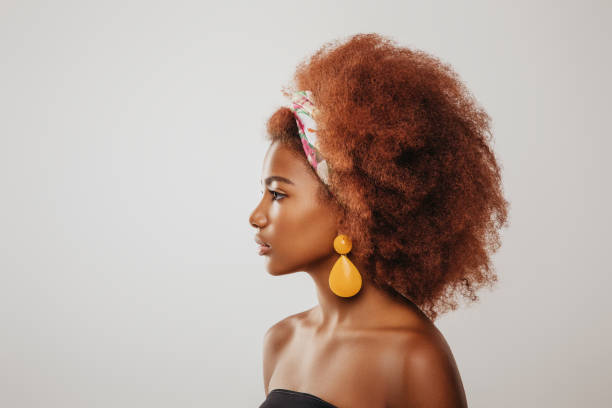 istock Beautiful afro girl with earrings 1243854498