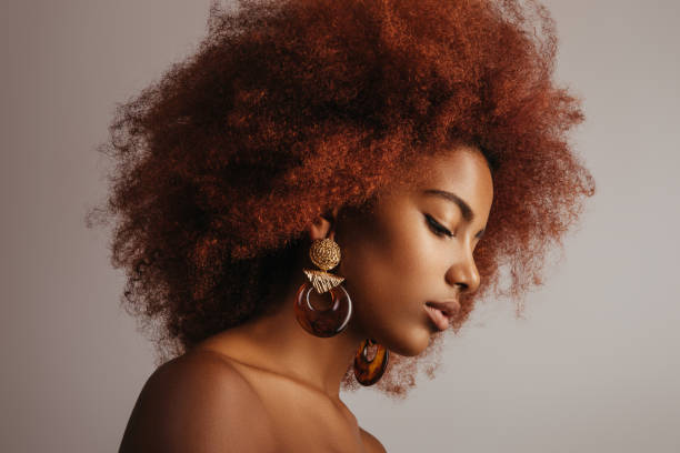 istock Beautiful afro girl with earrings 1243856581