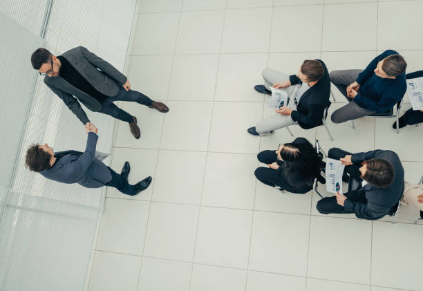 istock top view. working group with financial charts at a joint meeting 1243860264