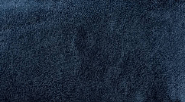 istock Dark blue leather texture background. Dark blue artificial leather background. 1243860811