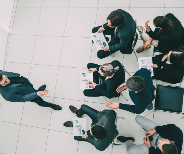 istock working group with financial documents sitting in the conference room 1243860833