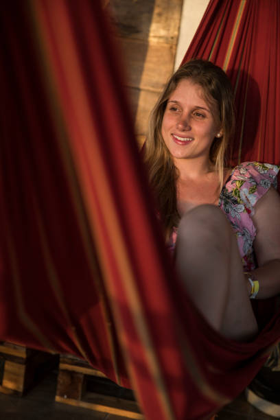 istock girl on a hammock looking the sun 1243868011