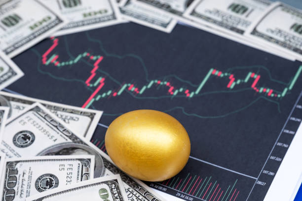 istock Golden egg and dollar bank note isolated on Bar graph background 1243869084