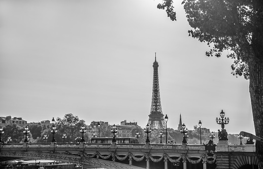 Urban landscape with the Eiffel tower and the river Seine at sunset Retro style