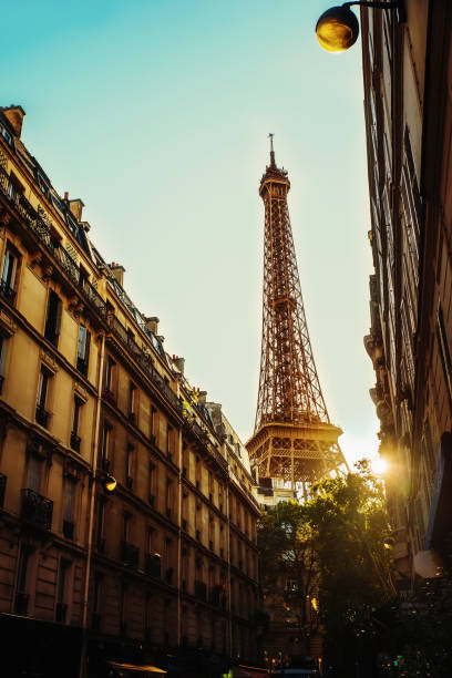 istock Urban landscape with the Eiffel tower and the rays of the setting sun 1243870254