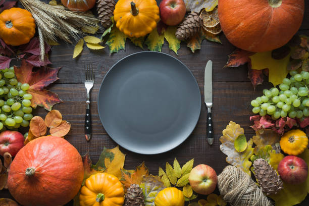 istock Autumn place setting with leaves and pumpkins 1243872389