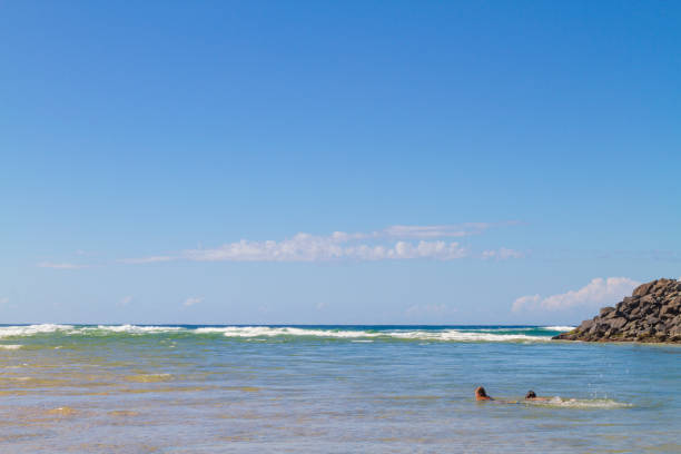 May 5, 2019 - Gold Coast, Queensland, Australia: People enjoying in Tallebudgera Creek with a sunny winter day.Tallebudgera Creek rises from the Springbrook Plateau below Burleigh Mountain in the Springbrook National Park near Upper Tallebudgera and north of the New South Wales/Queensland border.