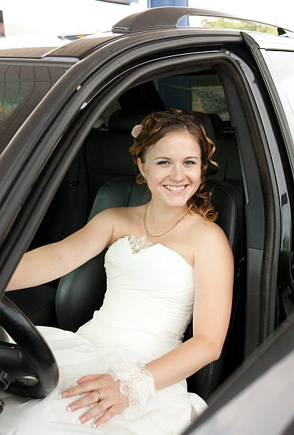 istock bride at the wheel a car 124390009